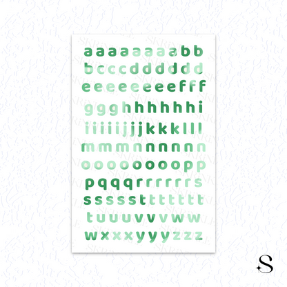 Alphabet cute journal stickers with green letters on a white background