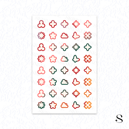 Sheet of small, colorful geometric cute journal stickers on a white background